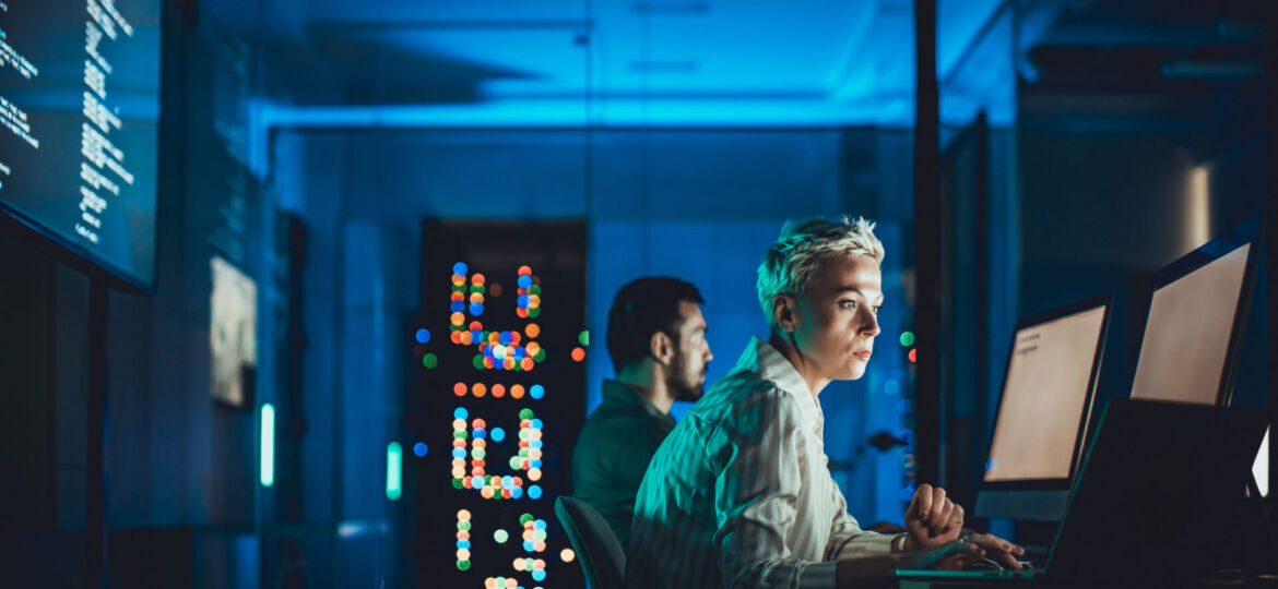 Caucasian female IT engineer working in server room